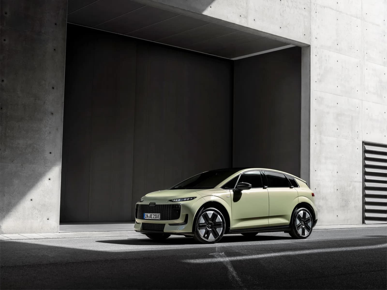 Green Audi A2 e-tron photographed from the front outdoors
