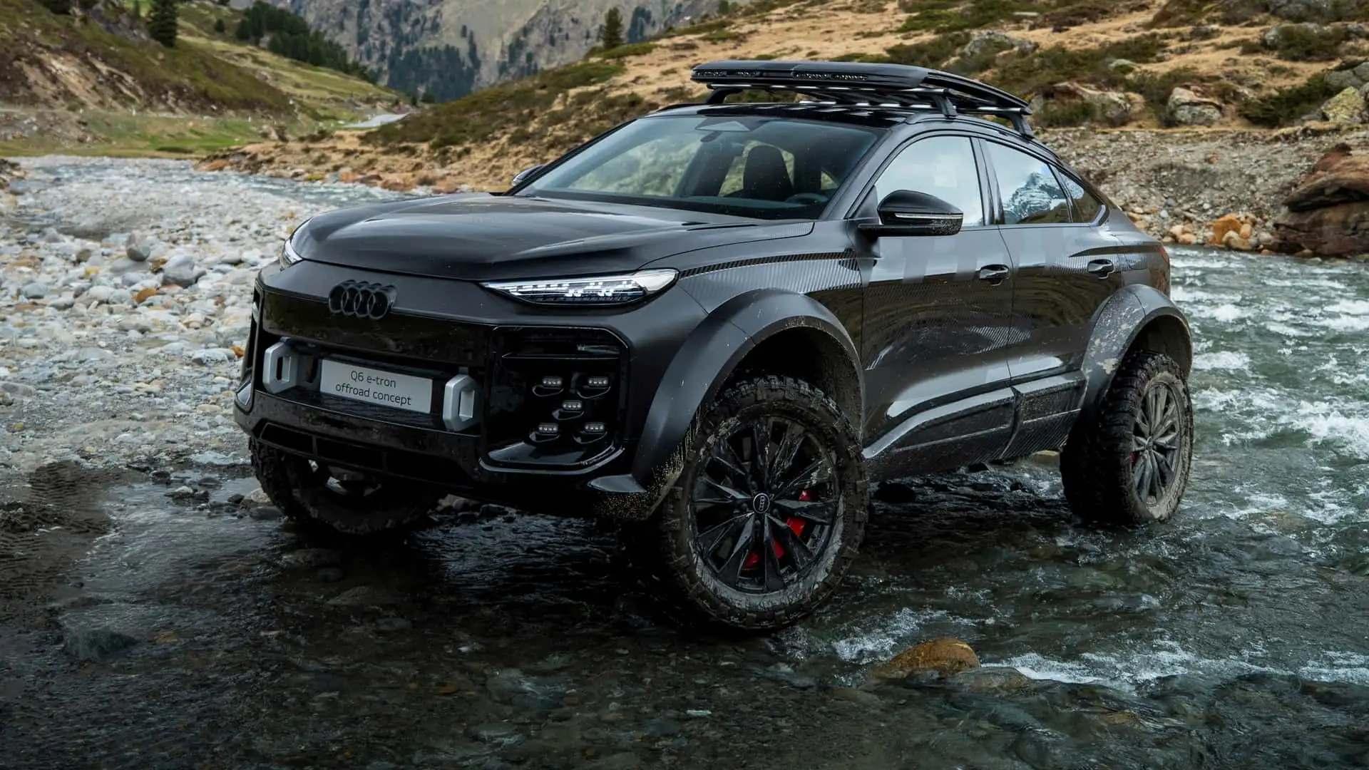Audi Q6 e-tron offroad concept shown on a rocky landscape