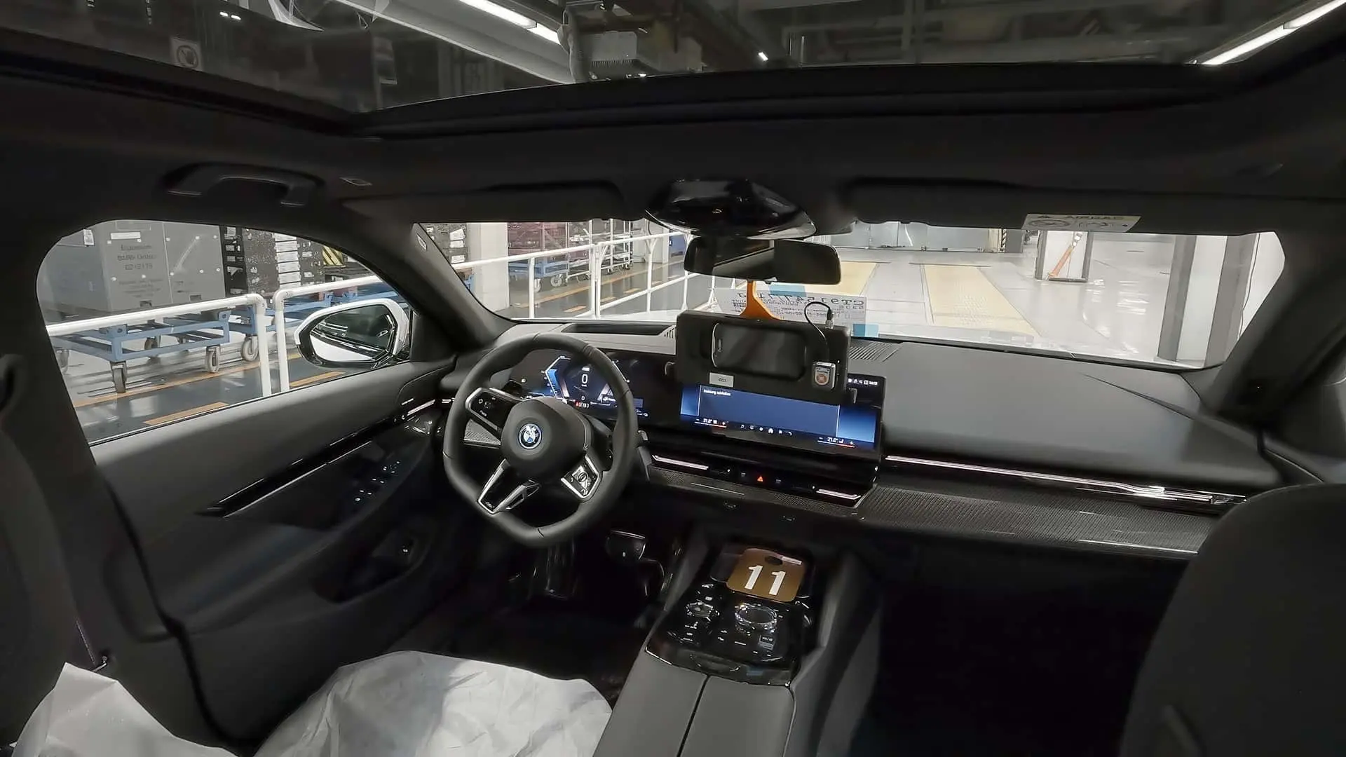 BMW vehicles being moved through a production plant with automated driving technology