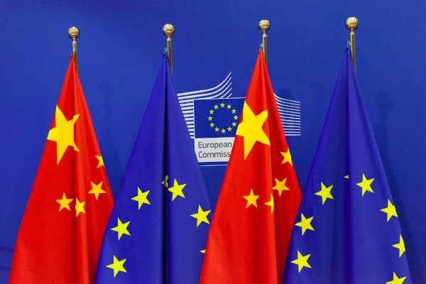 European Union and Chinese flags displayed during a trade dialogue