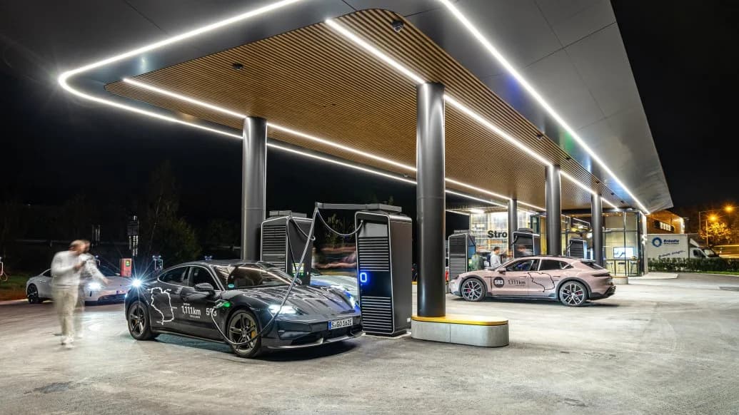 Porsche Taycan connected to a rapid charger during a long-distance journey