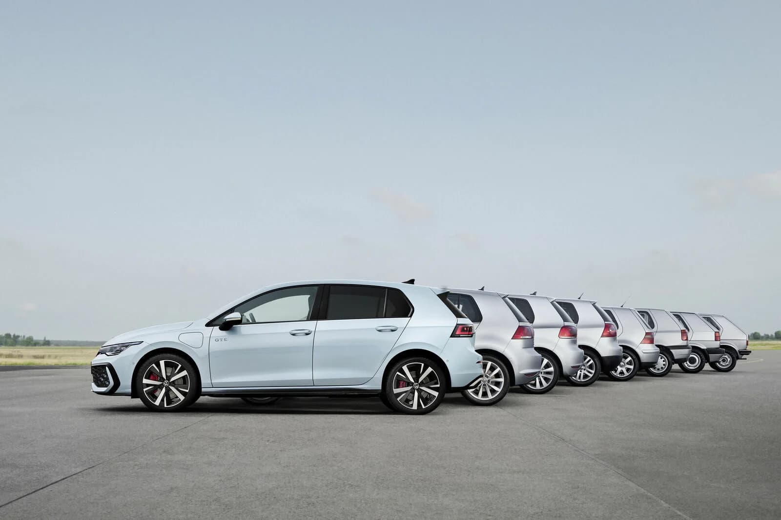 Volkswagen Golf driving on a road, viewed from the side