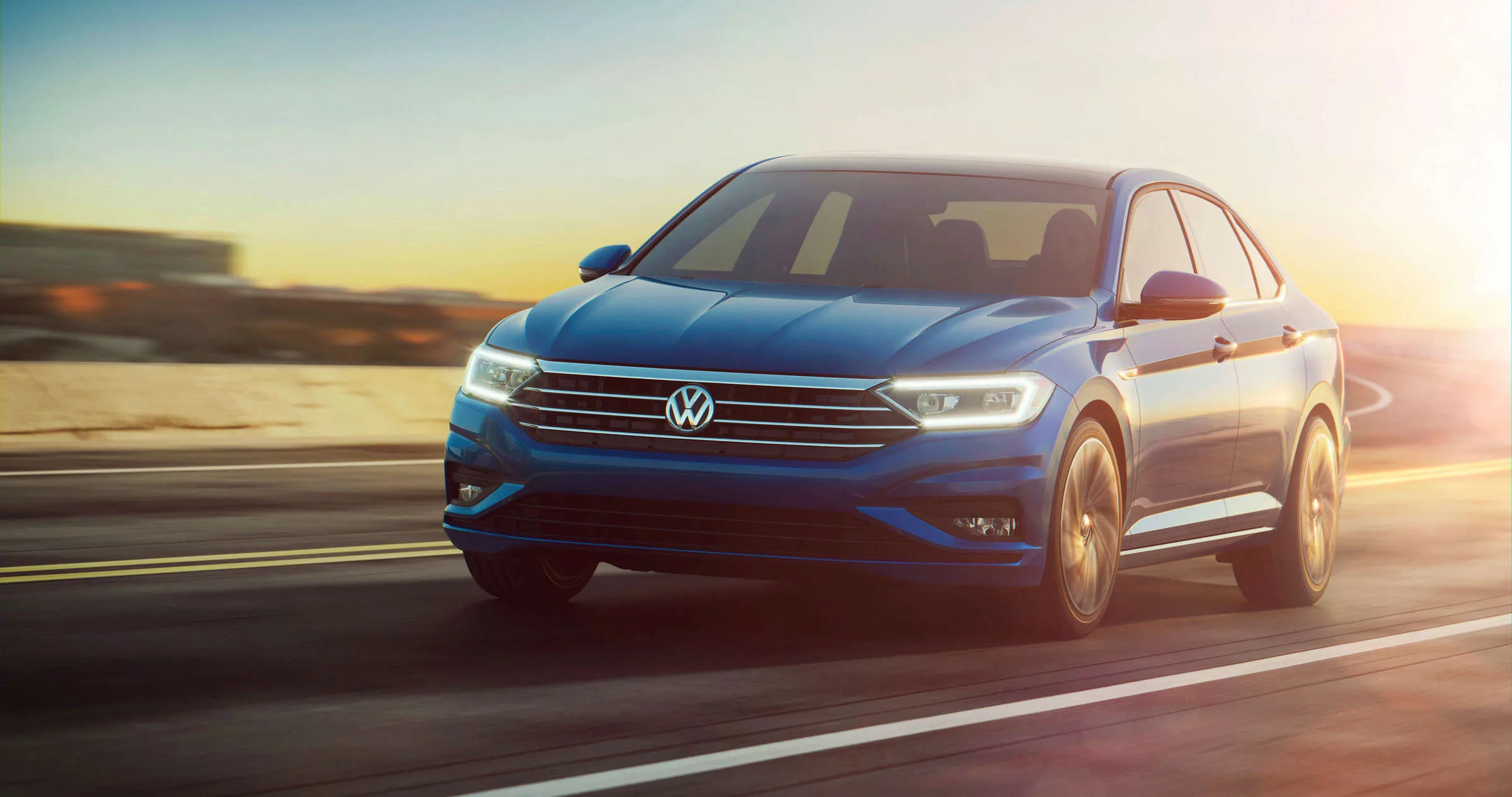 Offizielles Volkswagen-Foto einer Jetta-Limousine auf einer Straße