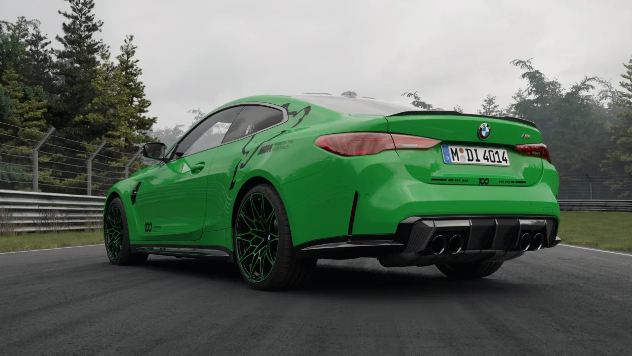 Green BMW M4 Coupé 100 Jahre Nürburgring on the circuit