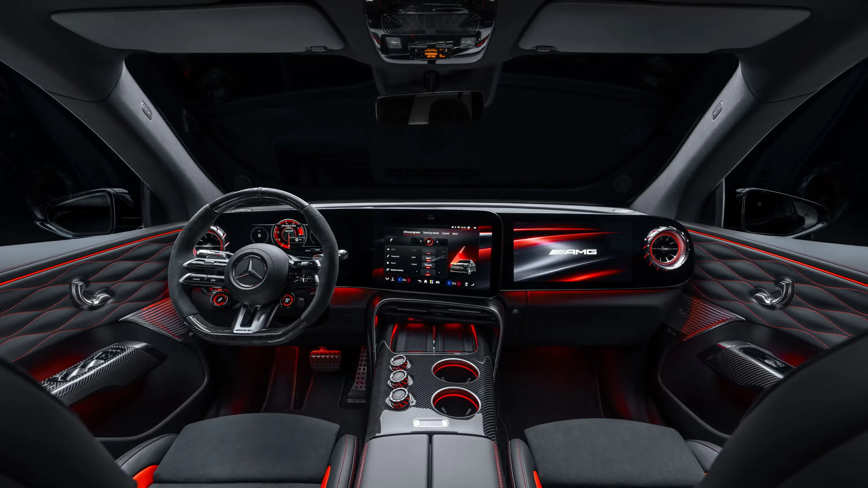 Interior view of the Mercedes-AMG GT SUV showing the steering wheel and AMG controls
