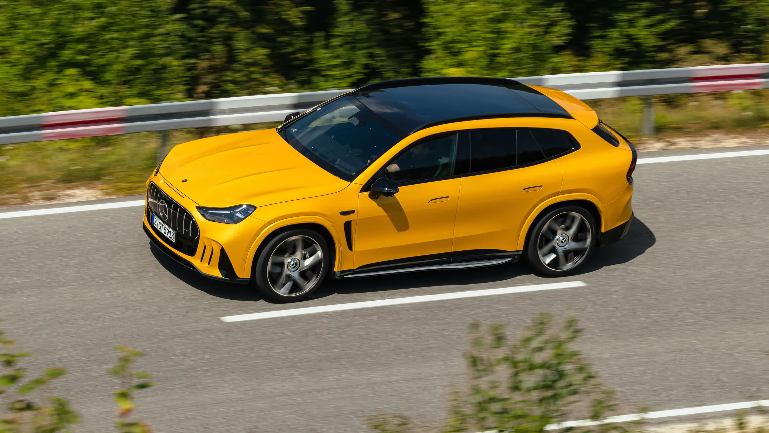 Mercedes-AMG GT SUV in side profile on a circuit