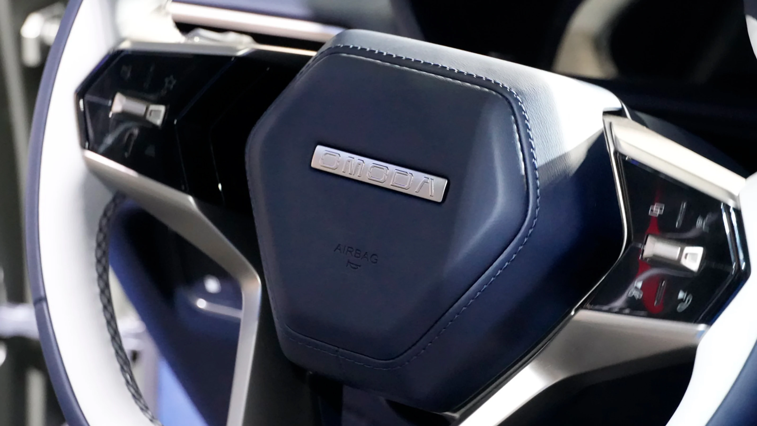 OMODA X steering-wheel controls in an Auto Express photograph