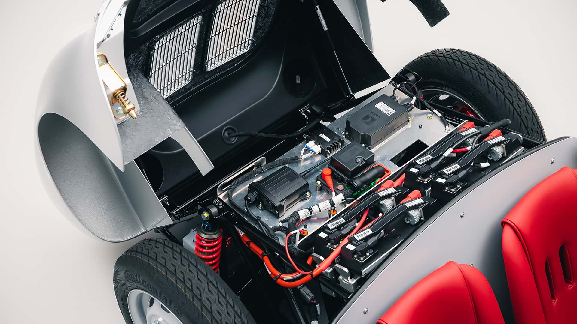 The electric drivetrain components installed behind the seats of the Porsche 550 J